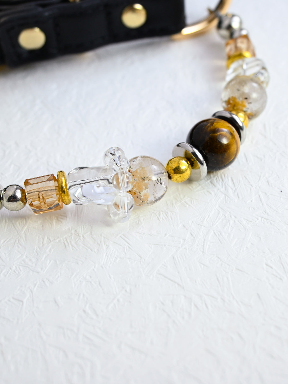 SoulBond Vintage Beaded Crystal Pet Collar detail of a brown striped bead, clear shaped beads and gold-tone spacers
