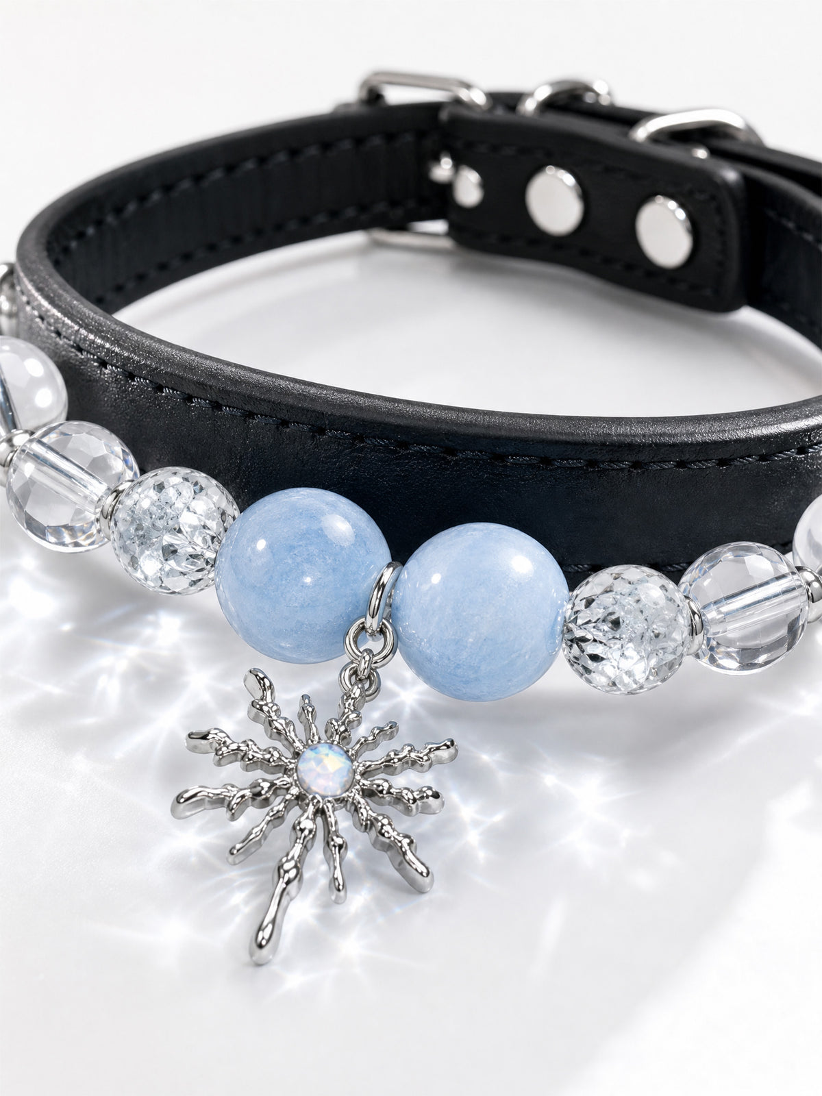 SoulBond Elegant Princess Crystal Pet Collar detail showing a stitched black strap, silver-tone rivets and blue beads