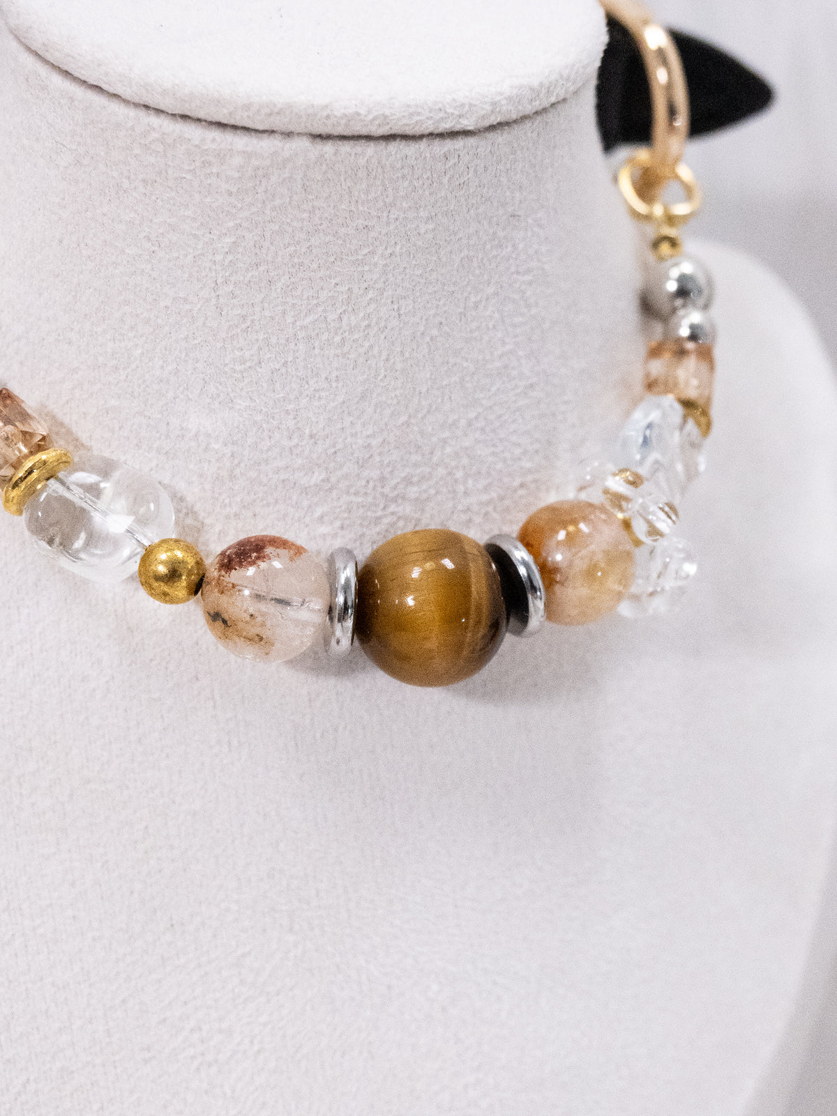 SoulBond Vintage Beaded Crystal Pet Collar close-up of brown and clear beads on a light-colored jewelry stand