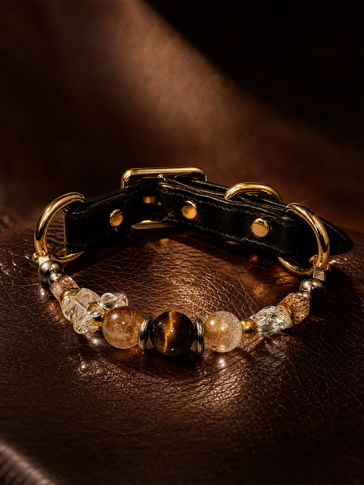 SoulBond Vintage Beaded Crystal Pet Collar with brown and clear beads and gold-tone hardware on a textured brown surface