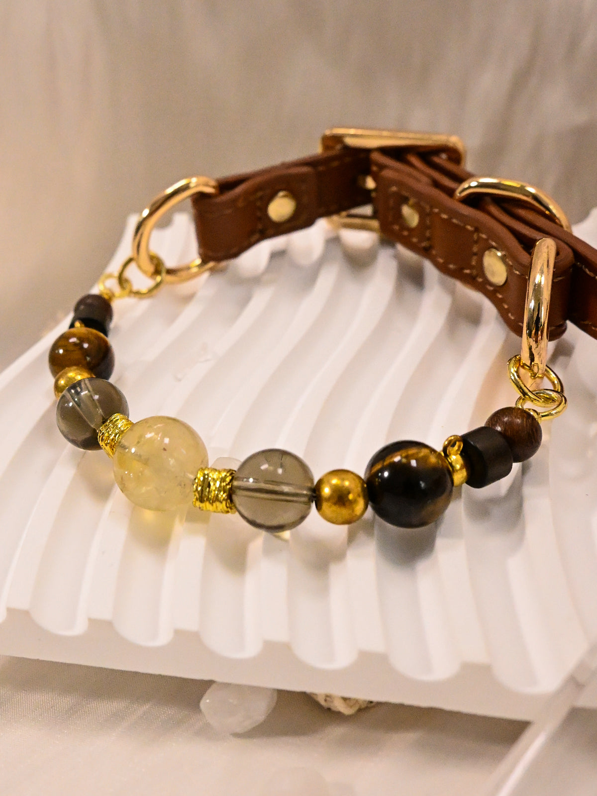 SoulBond Crystal Beaded Pet Collar angled view showing brown striped beads and gold-tone rings connecting to the brown strap