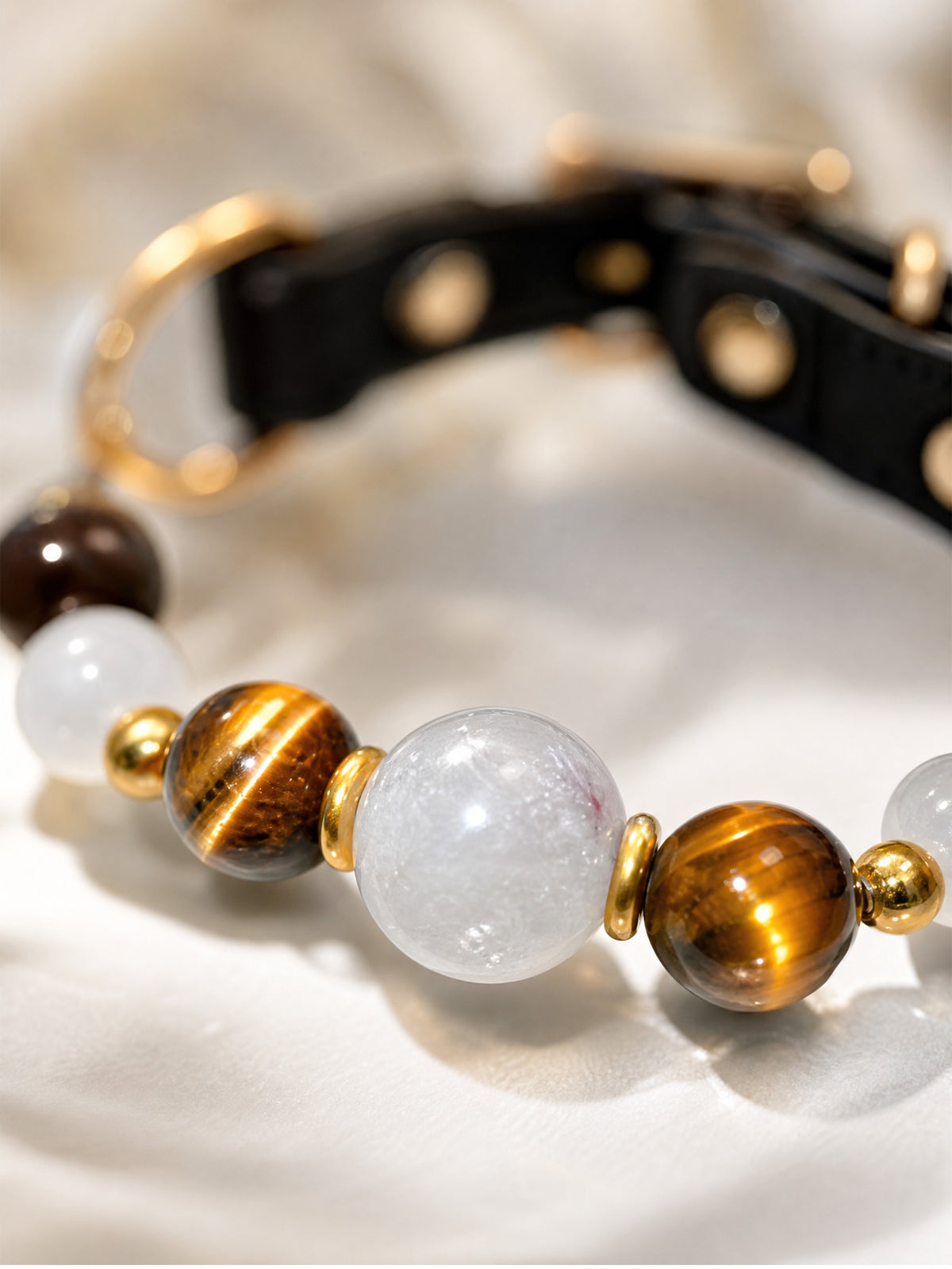SoulBond Old Money Crystal Beaded Cat Collar close-up of a translucent white center bead between two golden-brown striped beads
