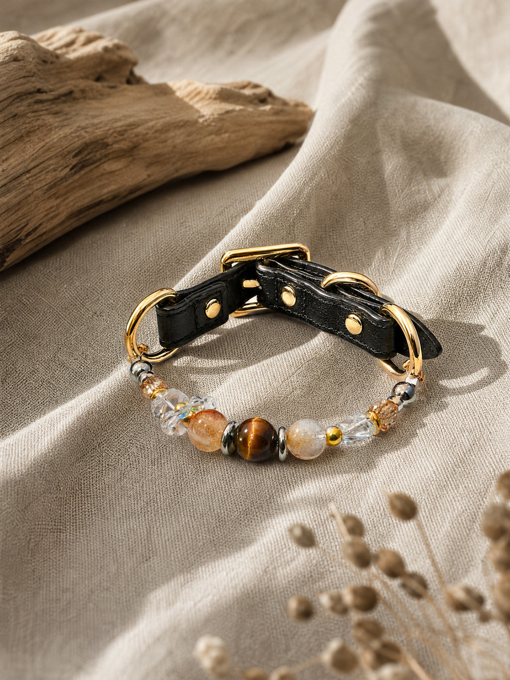 SoulBond Vintage Beaded Crystal Pet Collar with brown and clear beads on beige fabric beside driftwood and dried stems