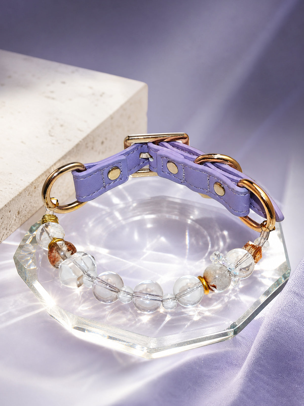 SoulBond White Crystal Cat Collar displayed on a clear octagonal tray over lavender fabric